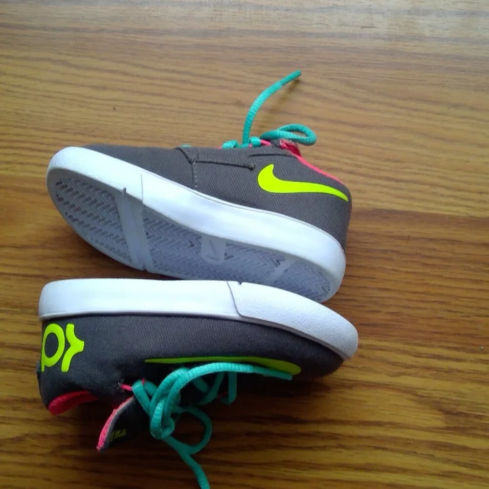 Nike Kids Dark Gray Sneakers with Neon Yellow Swoosh and Teal Laces